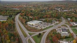 5.5K aerial stock footage approaching Route 11, Hanford Supermarket, small town, autumn, Winthrop, Maine Aerial Stock Footage | AX150_013