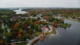 5.5K aerial stock footage approaching, flying over homes, small waterfront town, autumn, Winthrop, Maine Aerial Stock Footage | AX150_020