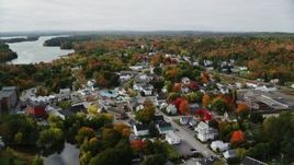 5.5K aerial stock footage flying over small town homes, Main Street, tilt down, autumn, Winthrop, Maine Aerial Stock Footage | AX150_021