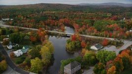 5.5K aerial stock footage approaching small bridges spanning Nezinscot River, Auburn River, autumn, Turner, Maine Aerial Stock Footage | AX150_050