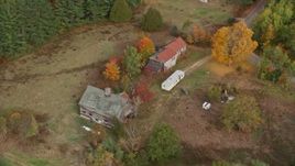 5.5K aerial stock footage flying by an old barn, colorful foliage in autumn, Turner, Maine Aerial Stock Footage | AX150_053