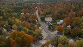5.5K aerial stock footage flying over small town, rural homes and Union Church, autumn, Buckfield, Maine Aerial Stock Footage | AX150_067E