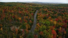 5.5K aerial stock footage flying over Buckfield Road, brightly colored trees in autumn, Paris, Maine Aerial Stock Footage | AX150_076
