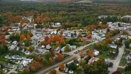5.5K aerial stock footage orbiting brightly colored foliage throughout small rural town, autumn, Paris, Maine Aerial Stock Footage | AX150_085