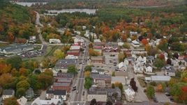 5.5K aerial stock footage flying over Main Street through small rural town, tilt down, autumn, Norway, Maine Aerial Stock Footage | AX150_096E
