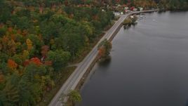 5.5K aerial stock footage flying over Lake Road, Pennesseewassee Lake, reveal waterfront rural homes, autumn, Norway, Maine Aerial Stock Footage | AX150_100E