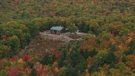 5.5K aerial stock footage flying by isolated hilltop home, colorful trees in autumn, Norway, Maine Aerial Stock Footage | AX150_106