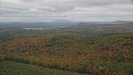 5.5K aerial stock footage flying by colorful forest in autumn, overcast, Norway, Maine Aerial Stock Footage | AX150_108E