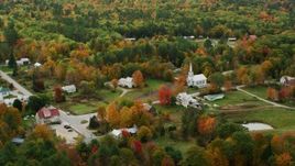 5.5K aerial stock footage orbiting small rural town and church, colorful foliage, autumn, Waterford, Maine Aerial Stock Footage | AX150_118