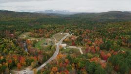 5.5K aerial stock footage approaching rural homes, Valley Road, colorful forest, autumn, Waterford, Maine Aerial Stock Footage | AX150_124