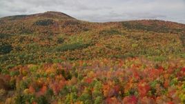 5.5K aerial stock footage flying over colorful forest, approaching cloudy skies, White Mountains, New Hampshire Aerial Stock Footage | AX150_164