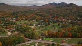 5.5K aerial stock footage orbiting small rural town, Wentworth Golf Club, autumn, cloudy, Jackson, New Hampshire Aerial Stock Footage | AX150_174E