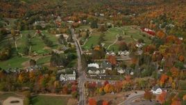 5.5K aerial stock footage approaching, flying over small rural town, Wentworth Golf Club, autumn, Jackson, New Hampshire Aerial Stock Footage | AX150_180E