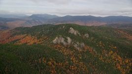 5.5K aerial stock footage flying by forest, Stairs Mountain, overcast, autumn, White Mountains, New Hampshire Aerial Stock Footage | AX150_192E