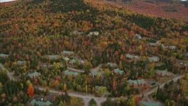 5.5K aerial stock footage flying by rural homes, colorful trees, autumn, Bretton Woods, Carroll, New Hampshire Aerial Stock Footage | AX150_212