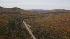5.5K aerial stock footage flying over forest, approach Highway 302, autumn, overcast, Carroll, New Hampshire Aerial Stock Footage | AX150_213E