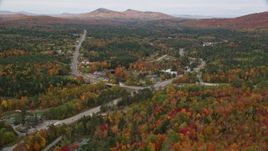 5.5K aerial stock footage flying over Highway 302, forest, approach small town, autumn, Carroll, New Hampshire Aerial Stock Footage | AX150_217E