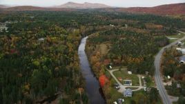 5.5K aerial stock footage flying over small rural town, Ammonoosuc River, autumn, Carroll, New Hampshire Aerial Stock Footage | AX150_220