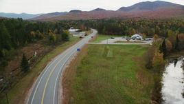 5.5K aerial stock footage approaching North Hampshire Department of Safety, autumn, Carroll, New Hampshire Aerial Stock Footage | AX150_223