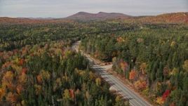 5.5K aerial stock footage flying over trees, foliage, approach Highway 302, autumn, Carroll, New Hampshire Aerial Stock Footage | AX150_224E