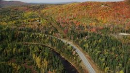 5.5K aerial stock footage flying over Highway 302, Ammonoosuc River, rural homes, forest, autumn, Carroll, New Hampshire Aerial Stock Footage | AX150_227