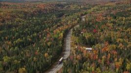 5.5K aerial stock footage flying over Highway 302 through forest, rural homes, autumn, Carroll, New Hampshire Aerial Stock Footage | AX150_228E