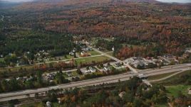 5.5K aerial stock footage approaching small rural town, Interstate 93, autumn, Franconia, New Hampshire Aerial Stock Footage | AX150_240E