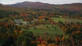 5.5K aerial stock footage approaching small rural town, colorful foliage, autumn, Sugar Hill, New Hampshire Aerial Stock Footage | AX150_246E