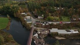 5.5K aerial stock footage orbiting rural town, covered bridge, church, Ammonoosuc River, autumn, Bath, New Hampshire Aerial Stock Footage | AX150_273E