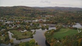 5.5K aerial stock footage flying over small farms Ammonoosuc River, approach rural town, autumn, Woodsville, New Hampshire Aerial Stock Footage | AX150_283E