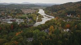 5.5K aerial stock footage of small bridges across Connecticut River, small towns autumn, Woodsville, New Hampshire and Wells River, Vermont Aerial Stock Footage | AX150_296E