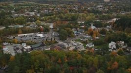 5.5K aerial stock footage of small rural towns, car dealership near Connecticut River, autumn, Wells River, Vermont Aerial Stock Footage | AX150_298E