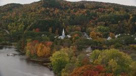 5.5K aerial stock footage flying over bridges, Connecticut River, approach small town, autumn, Wells River, Vermont Aerial Stock Footage | AX150_303E
