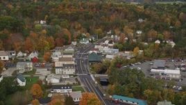 5.5K aerial stock footage flying by small rural town, tilting up Main Street, autumn, Wells River, Vermont Aerial Stock Footage | AX150_306