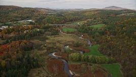 5.5K aerial stock footage approaching a small bridge, Interstate 91 across a small river, autumn, Wells River, Vermont Aerial Stock Footage | AX150_308E