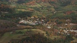 5.5K aerial stock footage flying by small rural town, grassy clearings, foliage in autumn, Ryegate, Vermont Aerial Stock Footage | AX150_314