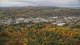 5.5K aerial stock footage flying by homes, colorful foliage, downtown, autumn, Barre, Vermont Aerial Stock Footage | AX150_342E