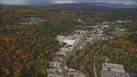 5.5K aerial stock footage flying by strip malls, Main Street, colorful foliage in autumn, Barre, Vermont Aerial Stock Footage | AX150_348E