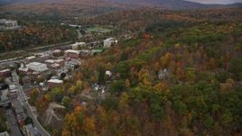 5.5K aerial stock footage flying by downtown buildings, panning right to colorful trees, Montpelier, Vermont Aerial Stock Footage | AX150_380