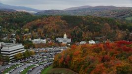 5.5K aerial stock footage flying by office building, Vermont State House, autumn, Vermont State House Aerial Stock Footage | AX150_386