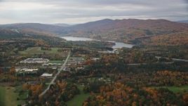 5.5K aerial stock footage flying by Berlin Pond, colorful trees, autumn, overcast, Barre, Vermont Aerial Stock Footage | AX150_395