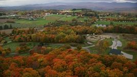 5.5K aerial stock footage flying by a cemetery, colorful trees, cloudy sky in autumn, Randolph Center, Vermont Aerial Stock Footage | AX150_406E