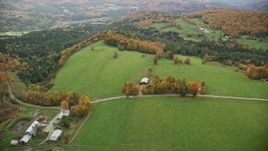5.5K aerial stock footage approaching Silloway Road, farms, colorful trees in autumn Randolph Center, Vermont Aerial Stock Footage | AX150_410E