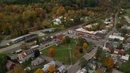 5.5K aerial stock footage orbiting colorful foliage throughout small rural town adjacent to the town square, autumn, South Royalton, Vermont Aerial Stock Footage | AX150_442E