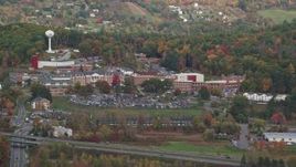 5.5K aerial stock footage flying by White River Junction VA Medical Center, autumn, White River Junction, Vermont Aerial Stock Footage | AX150_472E