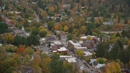5.5K aerial stock footage orbiting small rural town with colorful foliage in autumn, Woodstock, Vermont Aerial Stock Footage | AX151_017E