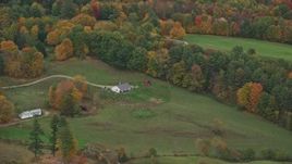 5.5K aerial stock footage flying by a small farm, colorful trees, autumn, Hartland, Vermont Aerial Stock Footage | AX151_043