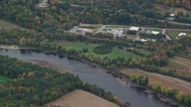 5.5K aerial stock footage flying by hedge maze, park along Connecticut River, autumn, Hartland, Vermont Aerial Stock Footage | AX151_048E
