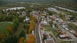 5.5K aerial stock footage flying over Main Street through small rural town, autumn, Windsor, Vermont Aerial Stock Footage | AX151_061E