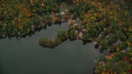5.5K aerial stock footage approaching waterfront homes, Perkins Pond, forest, autumn, Sunapee, New Hampshire Aerial Stock Footage | AX151_077E